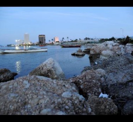 File In this 2012 Gleaner photo, fishing boats bob on the water, with banks and businesses seen far in the background along the Kingston waterfront.